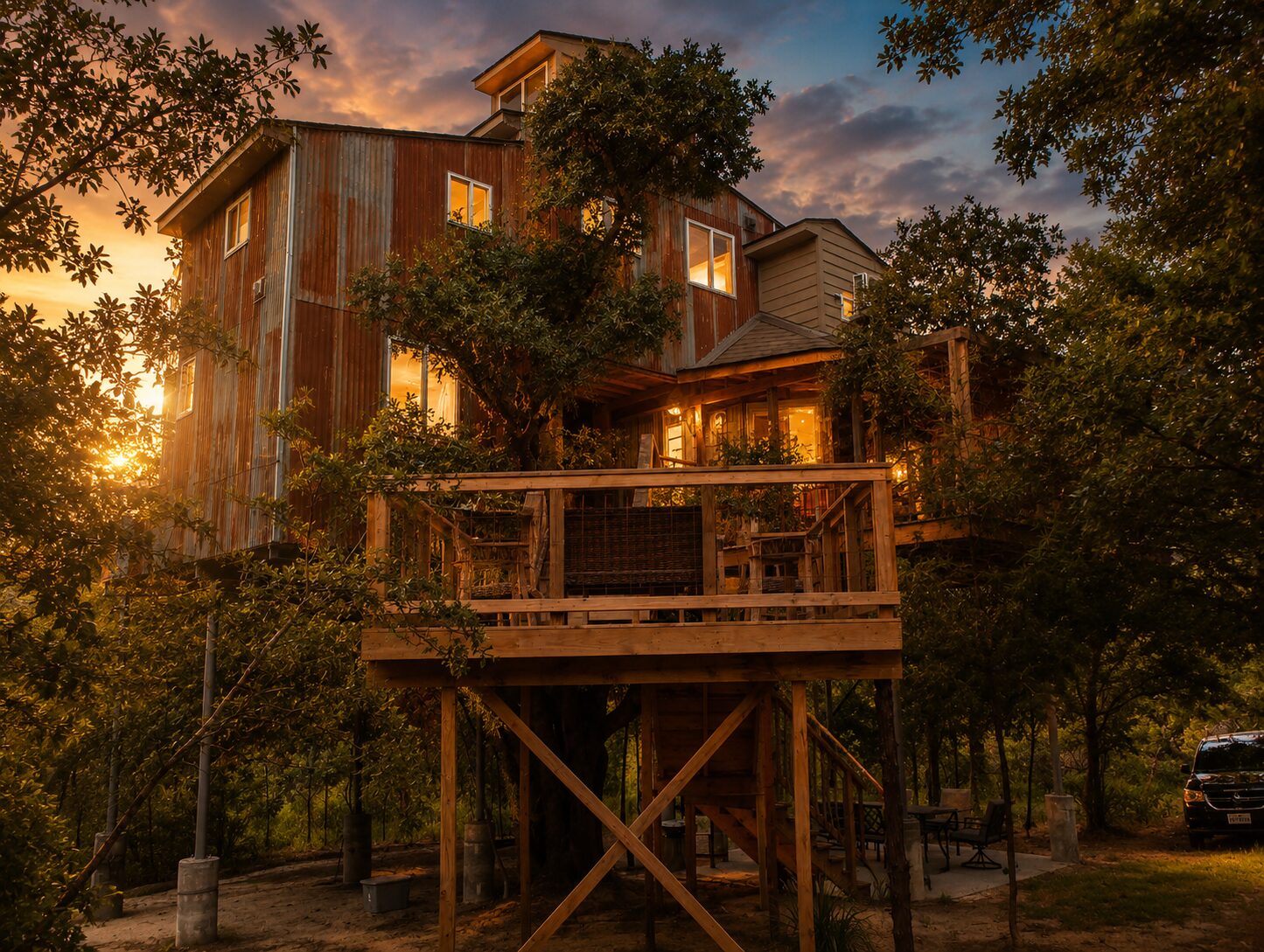 Upward Treehouse at dusk, glowing among the pines
